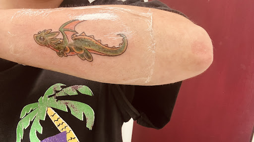Explore scale tattoo ideas, creative tattoo ideas in Anniston, available at Artistic Addictions