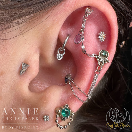 Explore cute ghost tattoo ideas, creative tattoo ideas in Bloomington, available at Crystal Moon Body Arts