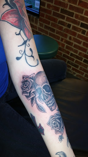 Explore rose tattoo idea, creative tattoo ideas in Sanford, available at Pandoras Box Tattoo Studio