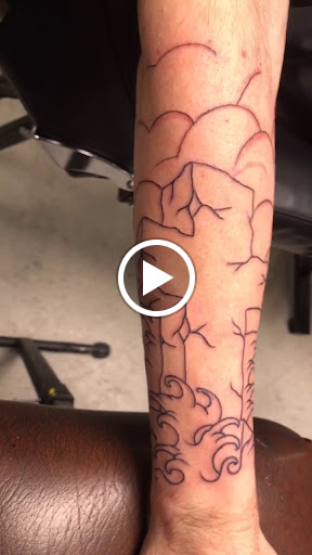 Explore tattoo ideas for behind the ear, creative tattoo ideas in Sanford, available at Hudson & Company Tattoo Studio