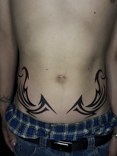 Explore lower arm half sleeve tattoo ideas, creative tattoo ideas in Orange, available at Top Floor Tattoo Studio