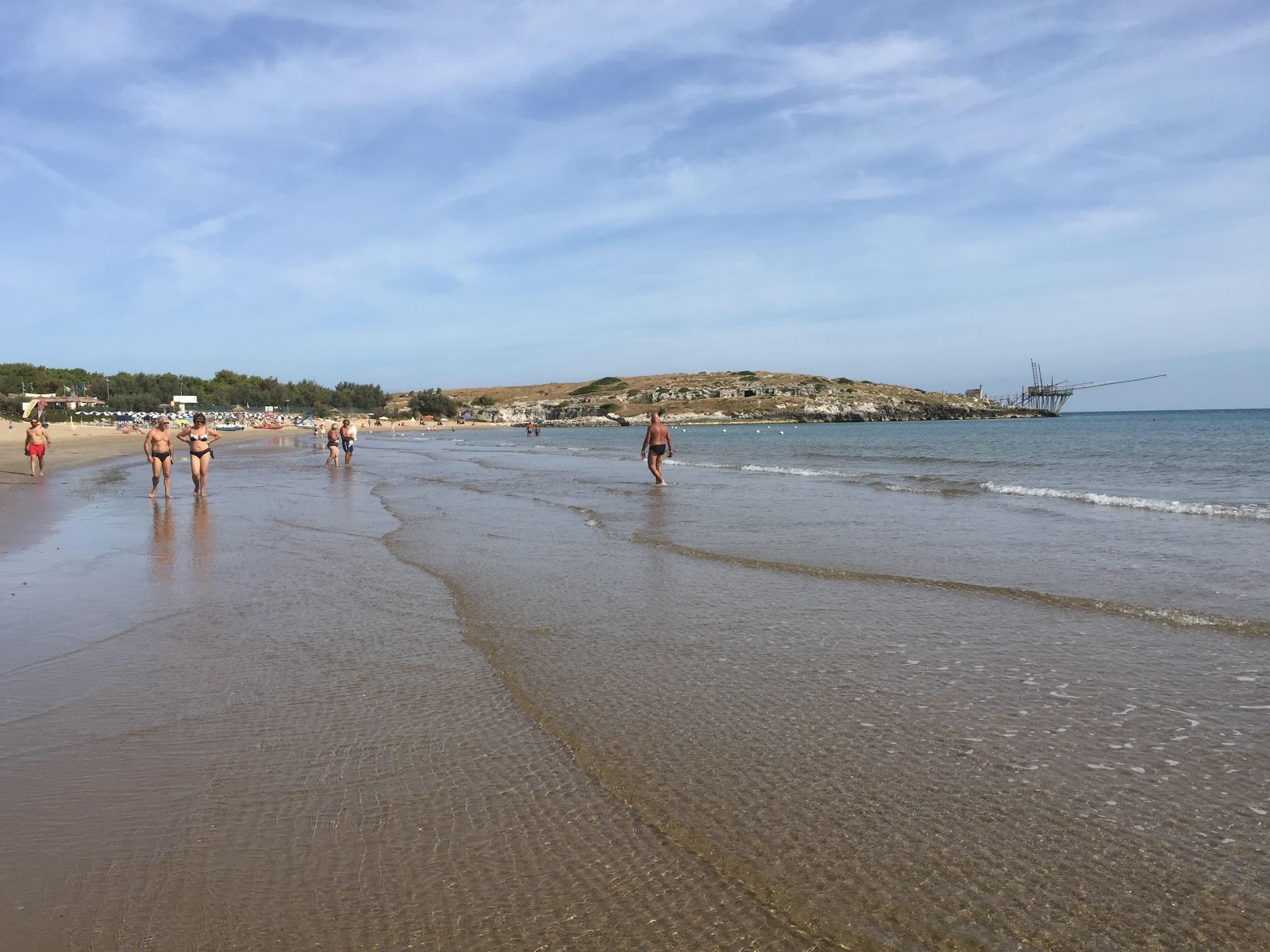 Foto van Spiaggia di Molinella met fijn bruin zand oppervlakte