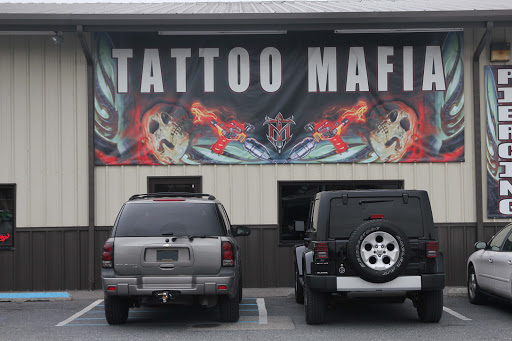 Explore one piece tattoos ideas, creative tattoo ideas in Dover, available at TATTOO MAFIA, INC.