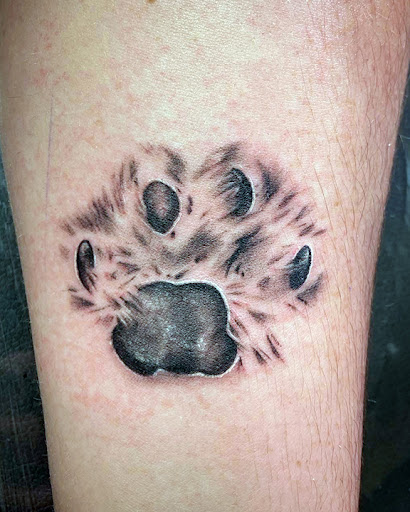 Explore dog paw tattoo ideas, creative tattoo ideas in Tempe, available at Club Tattoo