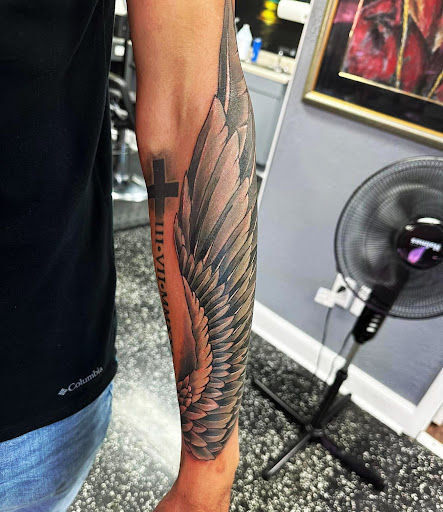 Explore blue bird tattoo ideas, creative tattoo ideas in Fort Myers, available at Loyal 2 The Coil Tattoos & Piercings (Edison Mall Location Entrance F)