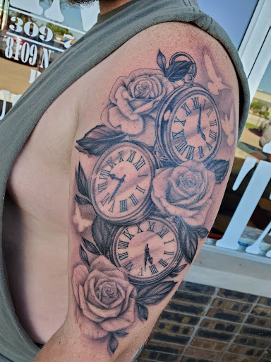 Explore black and grey sleeve tattoo ideas, creative tattoo ideas in Peoria, available at Guerrilla Ink Tattoos