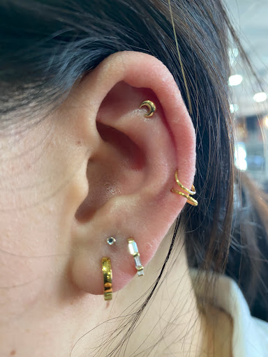 Explore first tattoo ideas for black females, creative tattoo ideas in Orange, available at Symbiosis Body Piercing