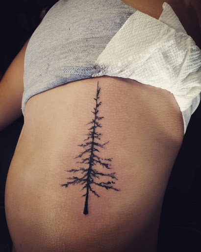 Explore whiskey tattoo ideas, creative tattoo ideas in Palm Harbor, available at Angry Owl Tattoo and Piercing