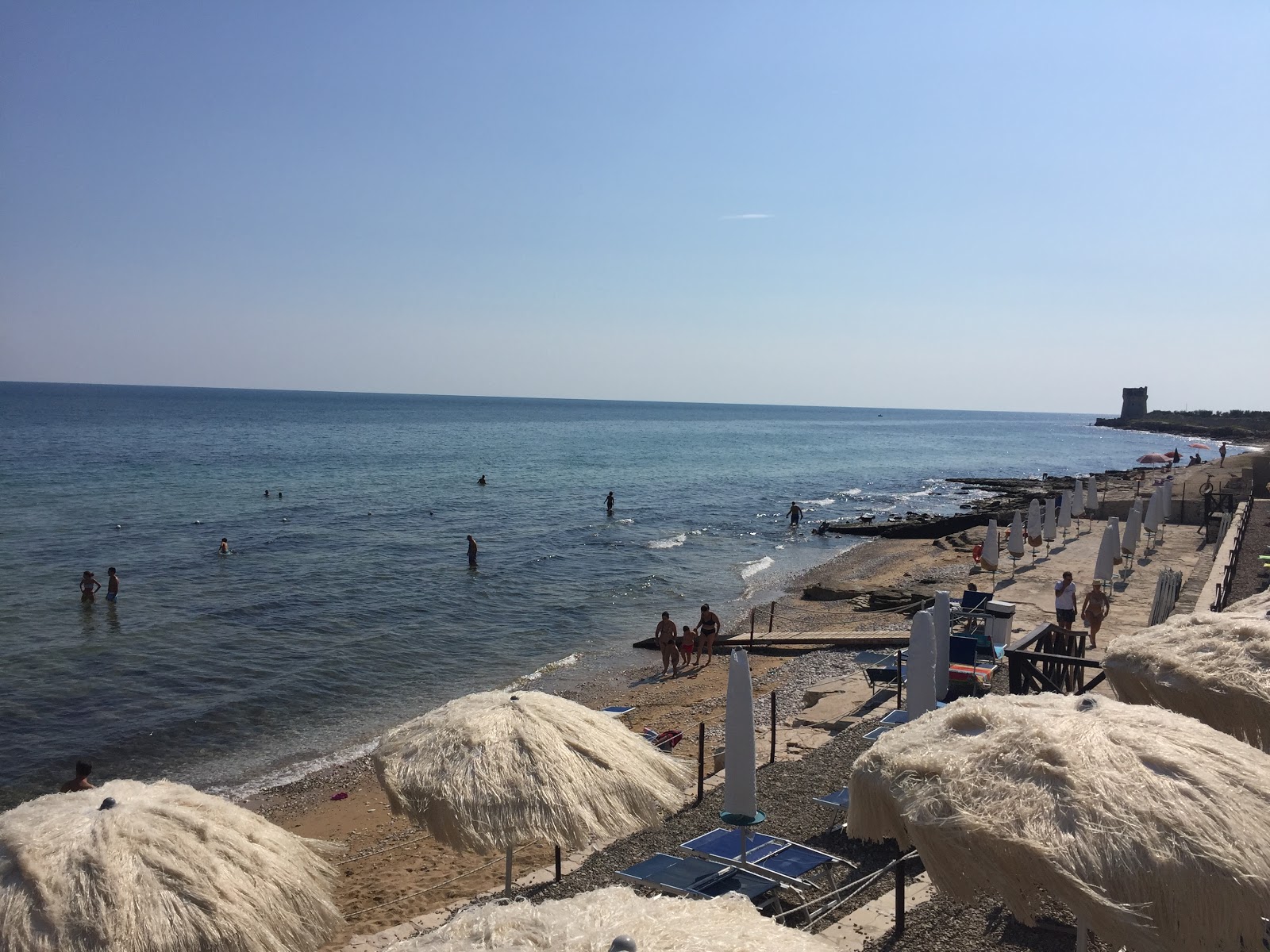 Foto von Torre Calderina beach mit lange, gerade küste