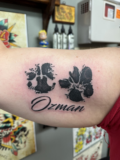Explore red bird tattoo ideas, creative tattoo ideas in Vincennes, available at Silver Owl Tattoo