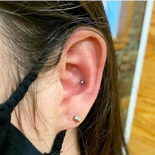 Explore black heart heart tattoo cover up ideas, creative tattoo ideas in North Charleston, available at Exotic Impressions Body Piercing