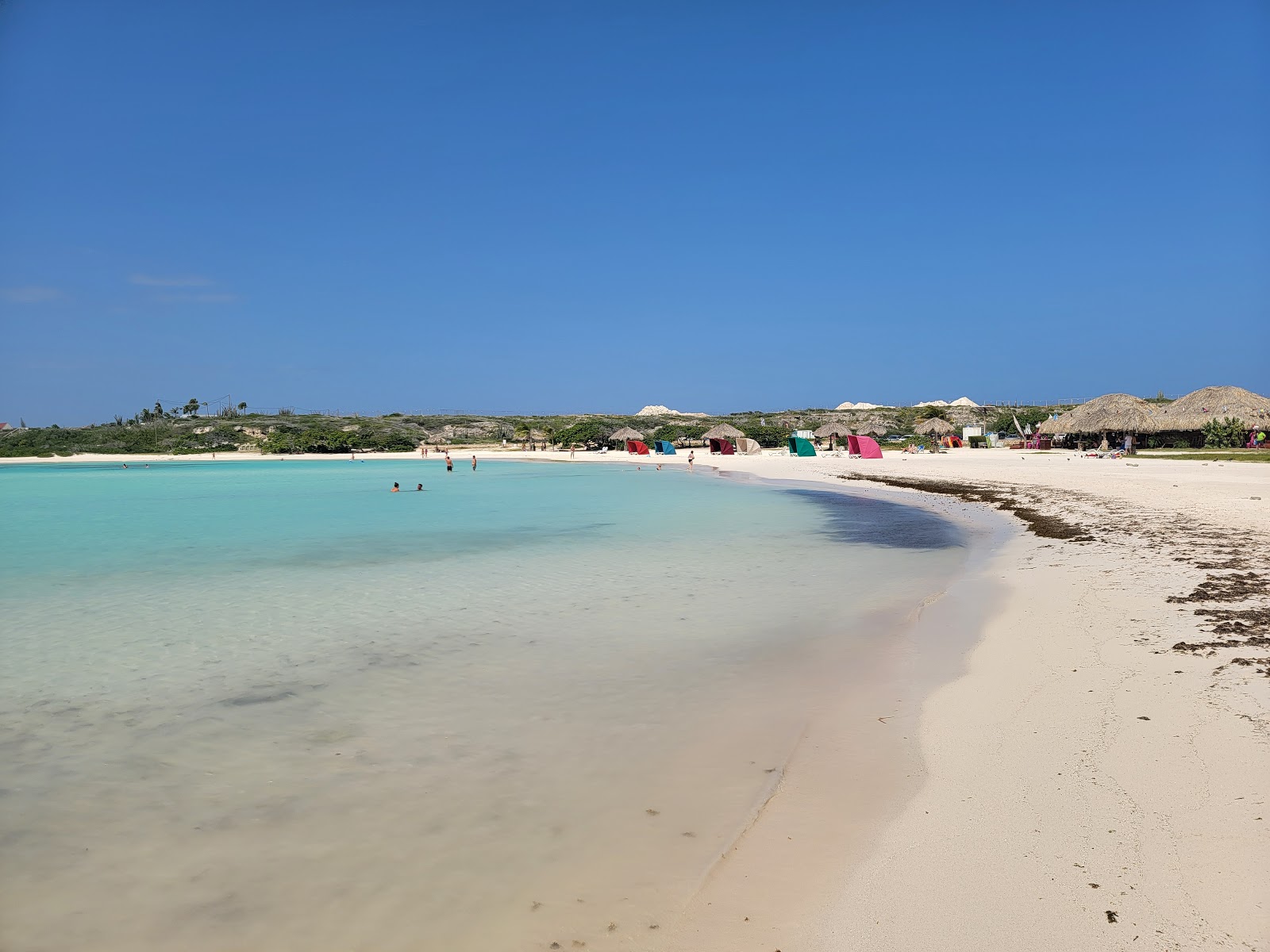 Foto av BarnStrand med fin beige sand yta