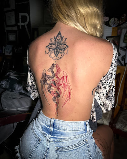 Explore female leg tattoo ideas, creative tattoo ideas in Moweaqua, available at Fleshwound Tattoo