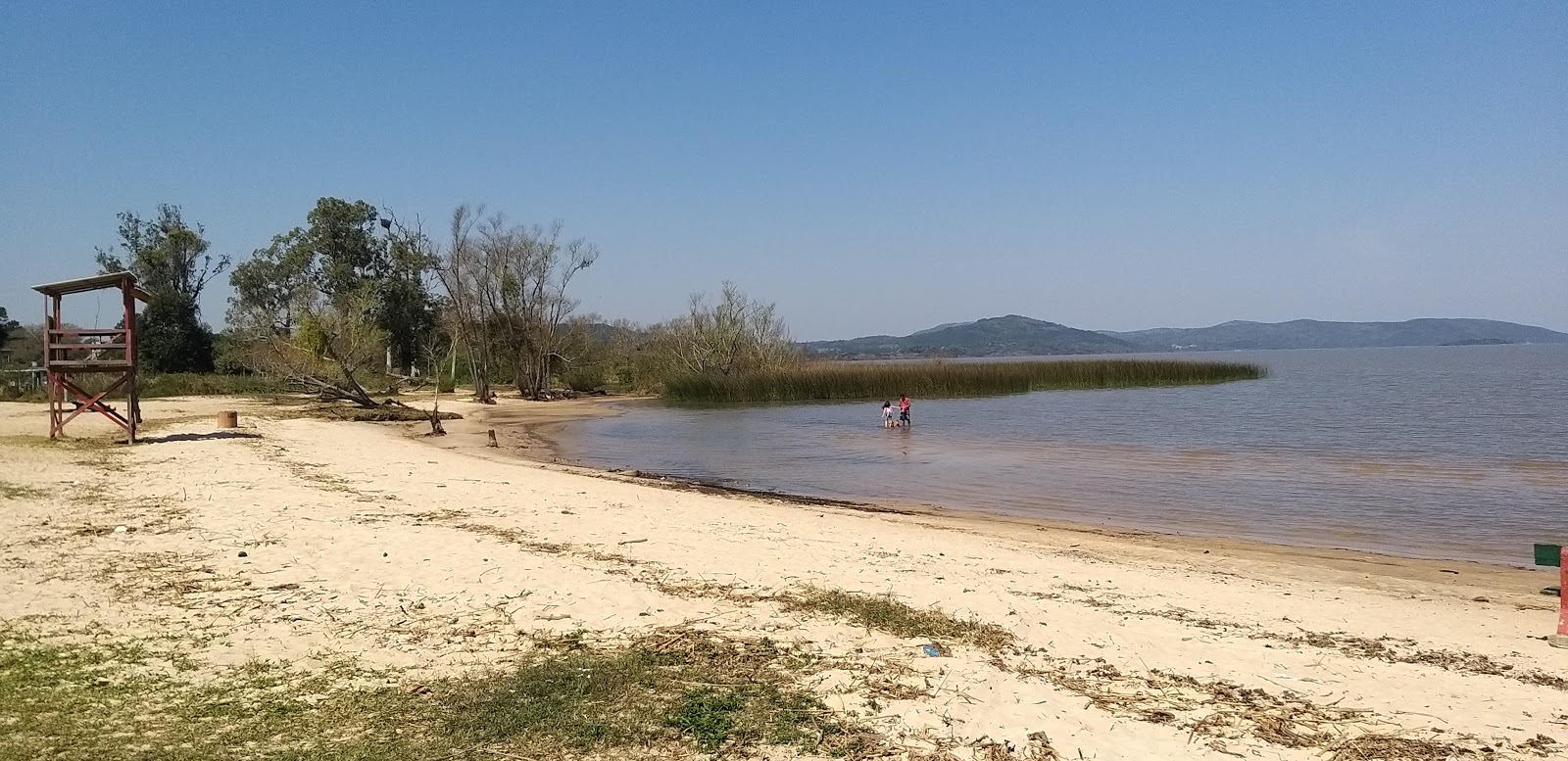 Foto di Praia de Itapua con una superficie del sabbia beige