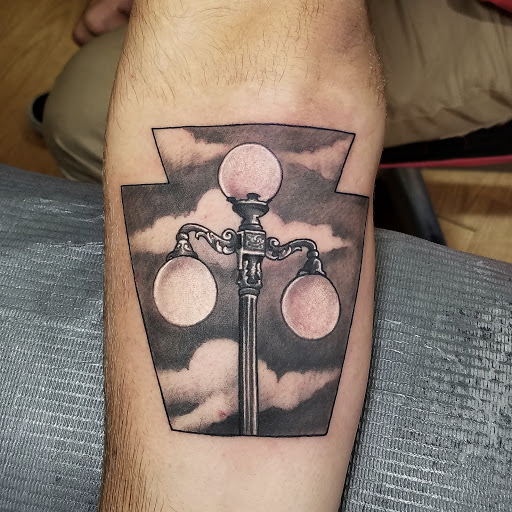 Find small wolf tattoo ideas for your next unique tattoo in Lewisburg at Acacia Tattoo Co.