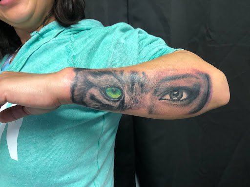 Explore hand tattoo ideas for men, creative tattoo ideas in Greenfield, available at Tattoos In Time Studio