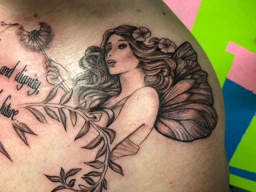 Explore race car tattoo ideas, creative tattoo ideas in Spokane, available at Platinum Rose Tattoo Studio