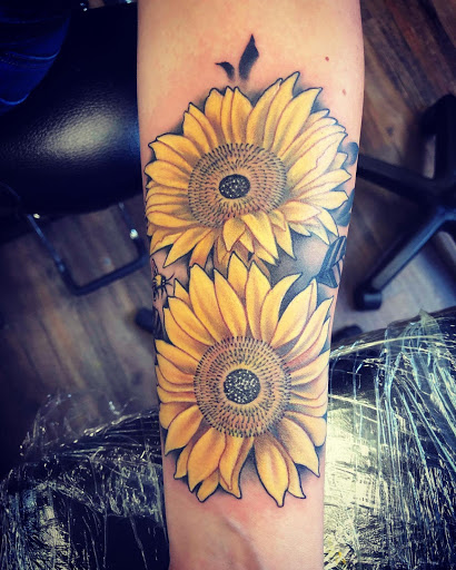 Explore tattoo ideas sun, creative tattoo ideas in Huntington, available at Golden Dagger Tattoos and Piercings