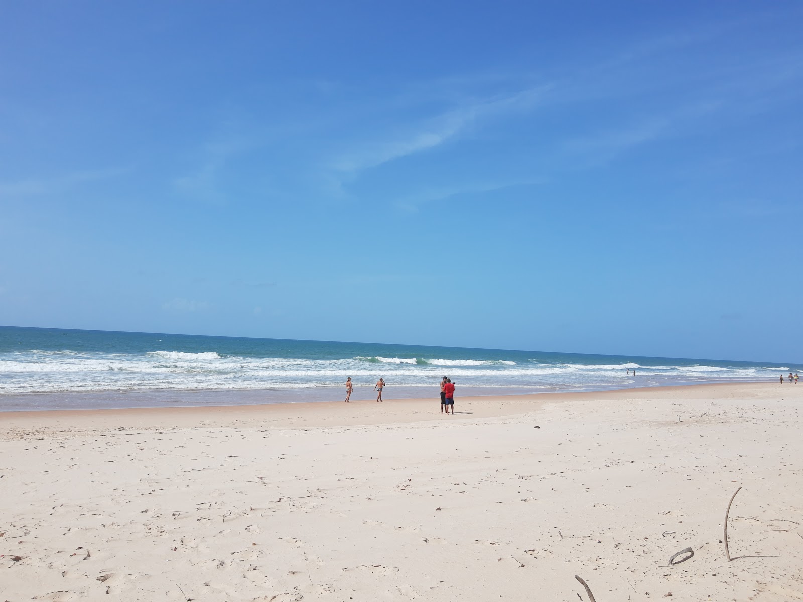 Valokuva Praia do Caribinhoista. pinnalla turkoosi puhdas vesi:n kanssa