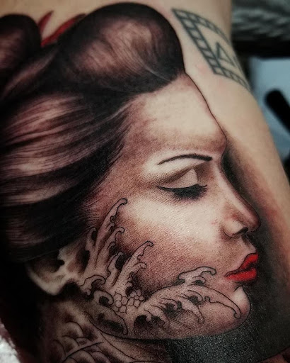 Explore rip cross tattoo ideas, creative tattoo ideas in Anchorage, available at SDITATTOO, LLC