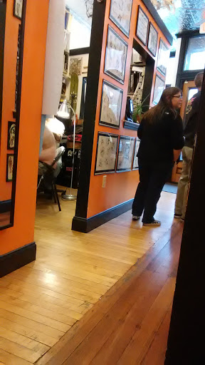 Explore small dragon tattoo ideas, creative tattoo ideas in Jamaica Plain, available at Fat Rams Pumpkin Tattoo