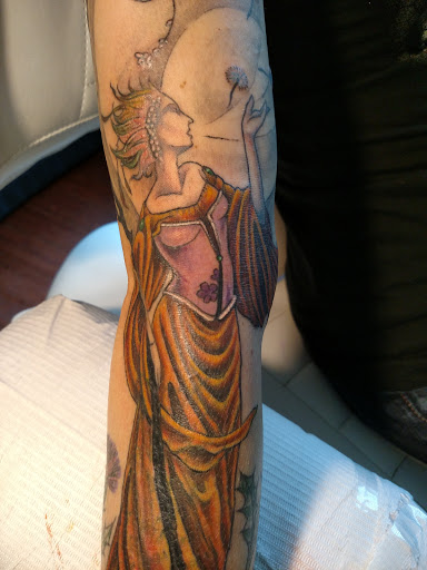 Explore dancing tattoo ideas, creative tattoo ideas in Woodstock, available at Ed Dempsey Tattoo Company