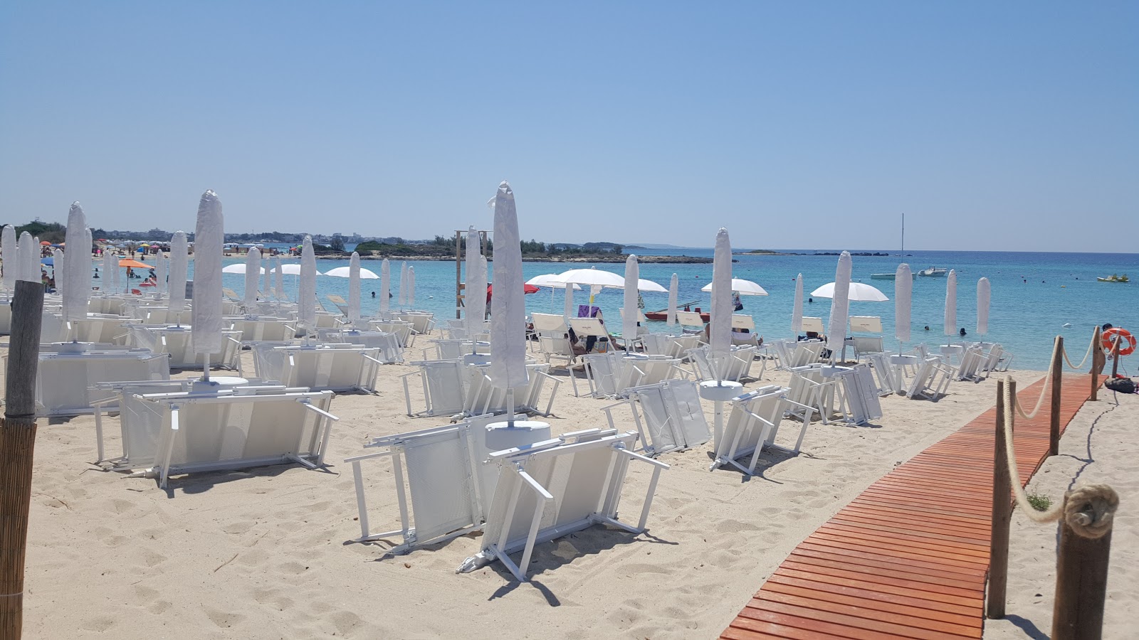 Foto von Spiaggia di Torre Chianca strandresort-gebiet