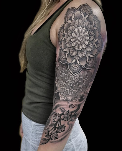Explore unique side thigh tattoo ideas, creative tattoo ideas in Sioux City, available at Living Art Tattoo Studio