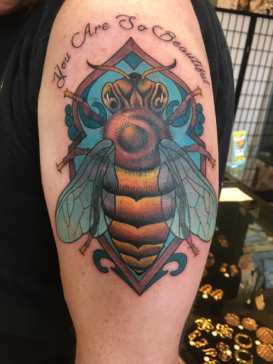 Explore august birth flower tattoo ideas, creative tattoo ideas in Asheville, available at Sacred Lotus Tattoo