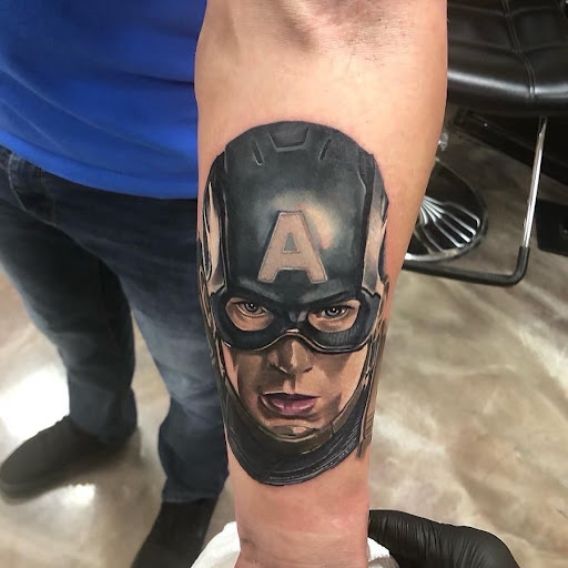 Explore little dragon tattoo ideas, creative tattoo ideas in Milwaukee, available at Planet Artz Tattoo Studio