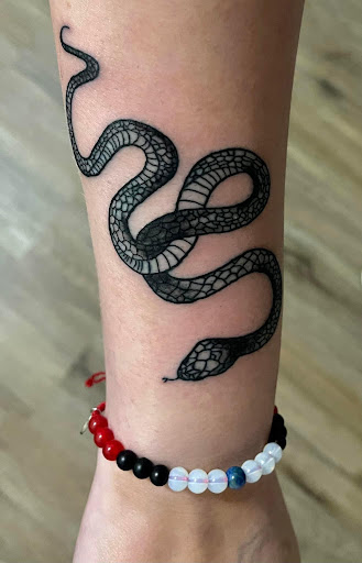 Explore green arrow tattoo ideas, creative tattoo ideas in Pineville, available at Epic Ink Studio