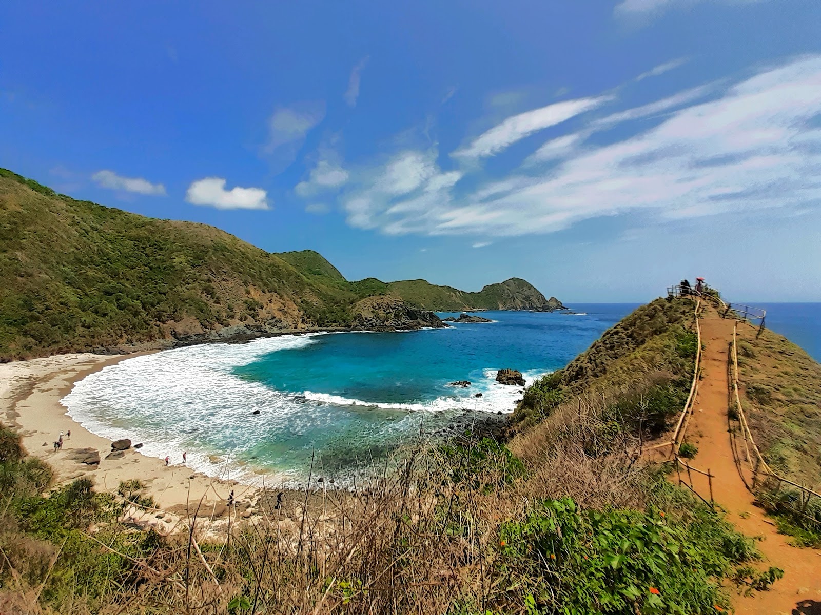 Photo of Telawas Beach with bright sand & rocks surface