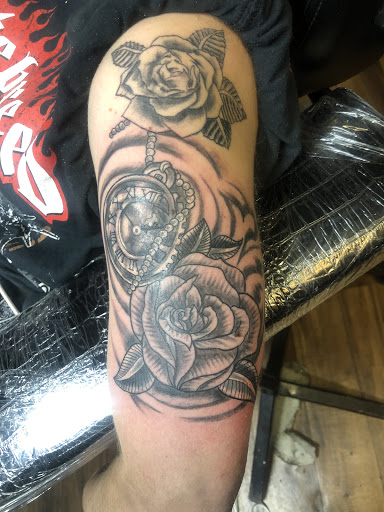 Explore bookish tattoo ideas, creative tattoo ideas in Birmingham, available at Heavily Tatted