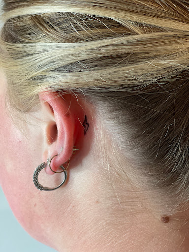 Explore tattoo flag ideas, creative tattoo ideas in Huxley, available at Lonely Bones Tattoo & Art