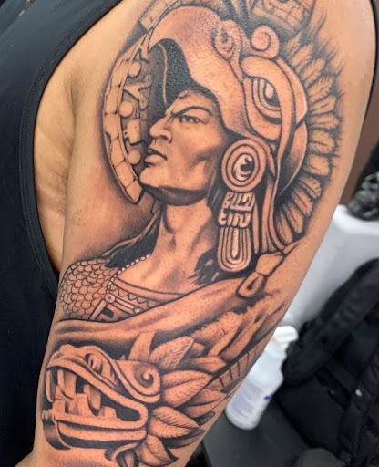Explore men back tattoos ideas, creative tattoo ideas in Fountain, available at United Tattoo