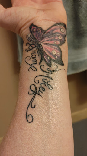 Explore men's behind the ear tattoo ideas, creative tattoo ideas in Lakewood, available at Rolling Rotary Tattoo & Art Galleria