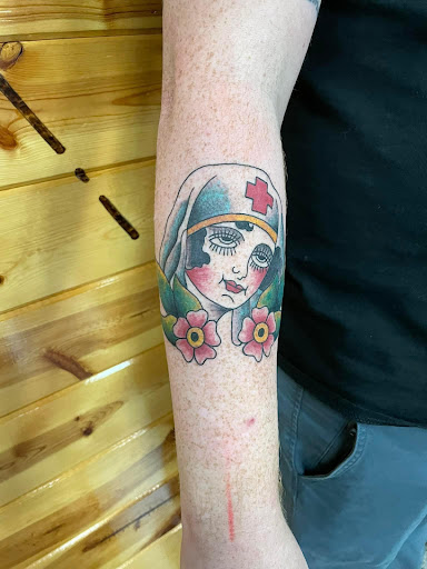 Explore gore tattoo ideas, creative tattoo ideas in Foley, available at Symbolic Ink Tattoo Studio