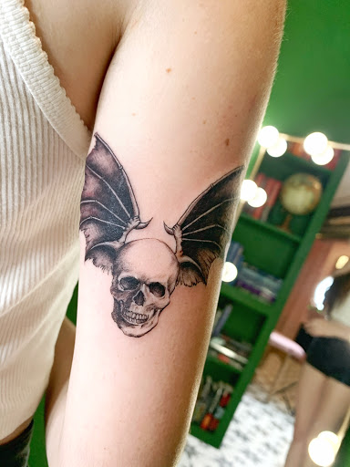 Explore tattoo ideas for back of the neck, creative tattoo ideas in Los Angeles, available at Supersweet Tattoos and Coffee