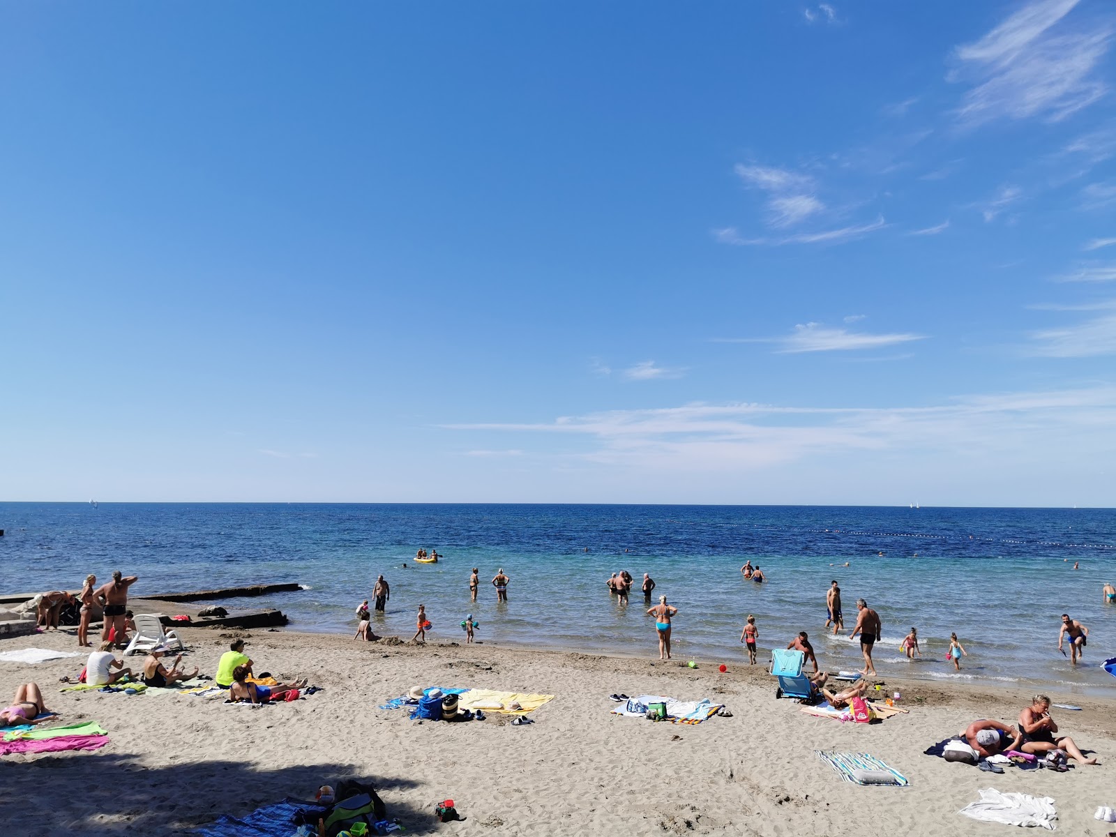 Foto di Umag Sandy beach con una superficie del sabbia grigia e ciottoli