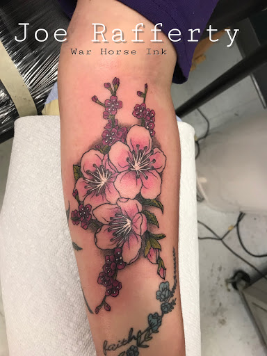 Explore upper arm tattoo ideas for guys, creative tattoo ideas in Kent, available at War Horse Ink