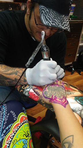Find background tattoo ideas for guys for your next unique tattoo in Peoria at Big Top Tat2
