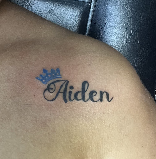 Explore women's lower back tattoo ideas, creative tattoo ideas in Goshen, available at Stab Me Pretty Studio