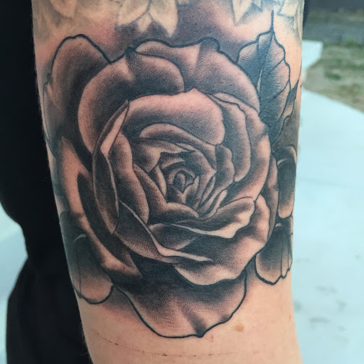 Explore flower arm tattoo ideas, creative tattoo ideas in Reno, available at Aces Tattoo