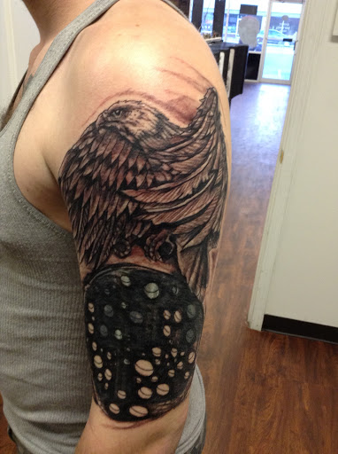 Explore watercolor flower tattoo ideas, creative tattoo ideas in Seymour, available at American Gypsy Tattoo Corp.