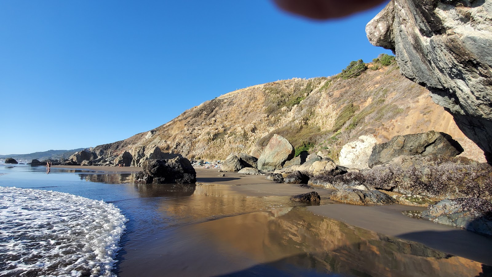 Fotografie cu Red Rock Beach cu nivelul de curățenie înalt