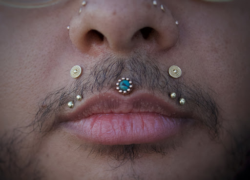Explore face tattoo ideas, creative tattoo ideas in Corona Del Mar, available at Rainbow Piercing & Jewelry