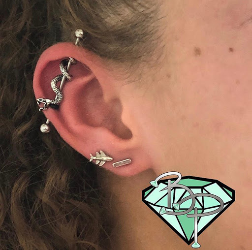 Find background tattoo ideas for guys for your next unique tattoo in Columbus at Bella Piercings, LLC.