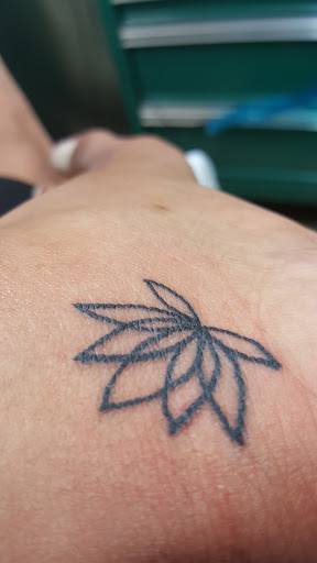 Find necklace tattoo ideas for your next unique tattoo in Laramie at Rolling Tattoo