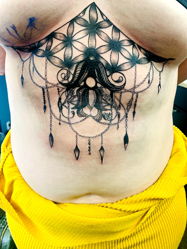 Explore shoulder sleeve tattoo ideas, creative tattoo ideas in Lake City, available at Crooked Spines Tattoo Studio