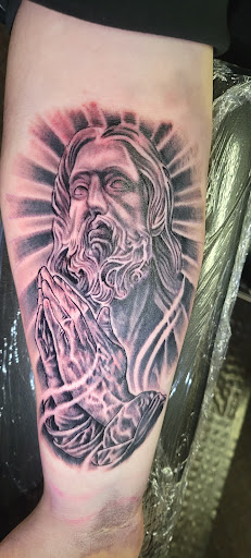 Explore temple tattoo ideas, creative tattoo ideas in Angola, available at Hoodlum Ink